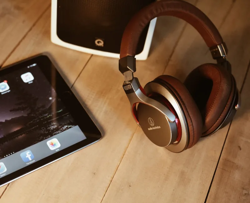 Audio Technica headphones next to an iPad