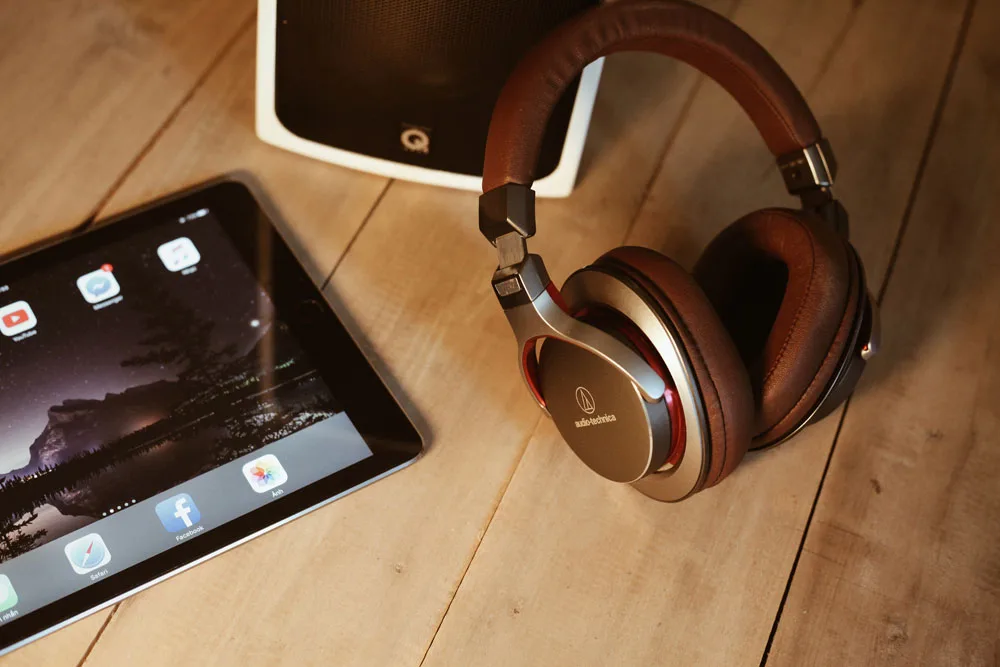 Audio Technica headphones next to an iPad